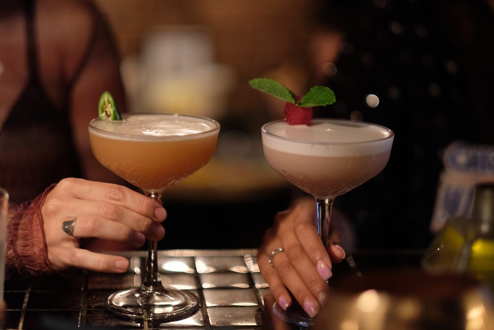 Friends toasting cocktails at a birthday celebration